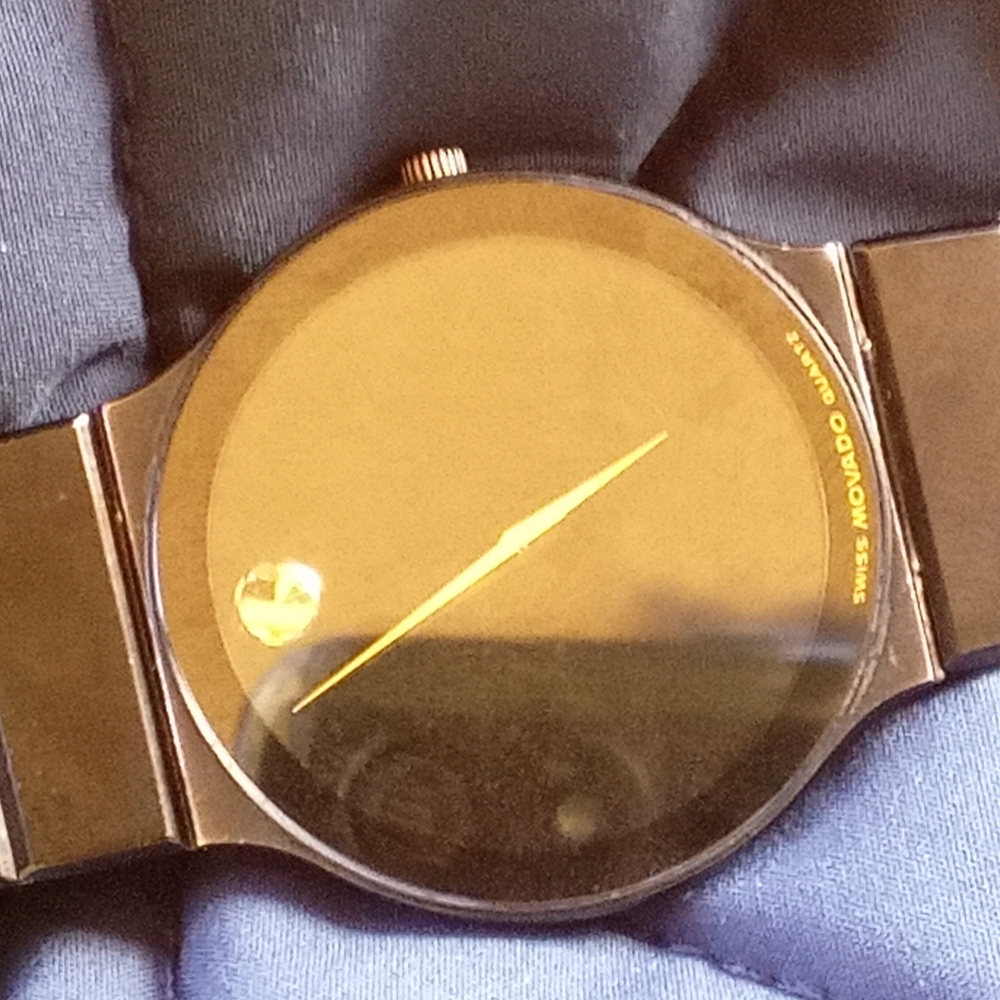 Black And Gold Analog Watch.